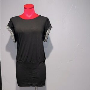 Forever 21 black stretchy form fitting top or dress with silver beads.
